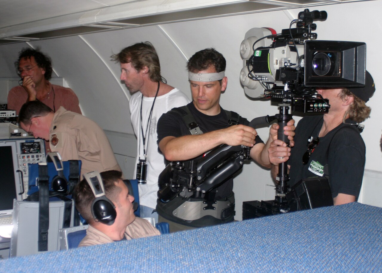 A crew films inside an aircraft for Transformers in 2006; archival production photograph, not The Odyssey. Photo:
